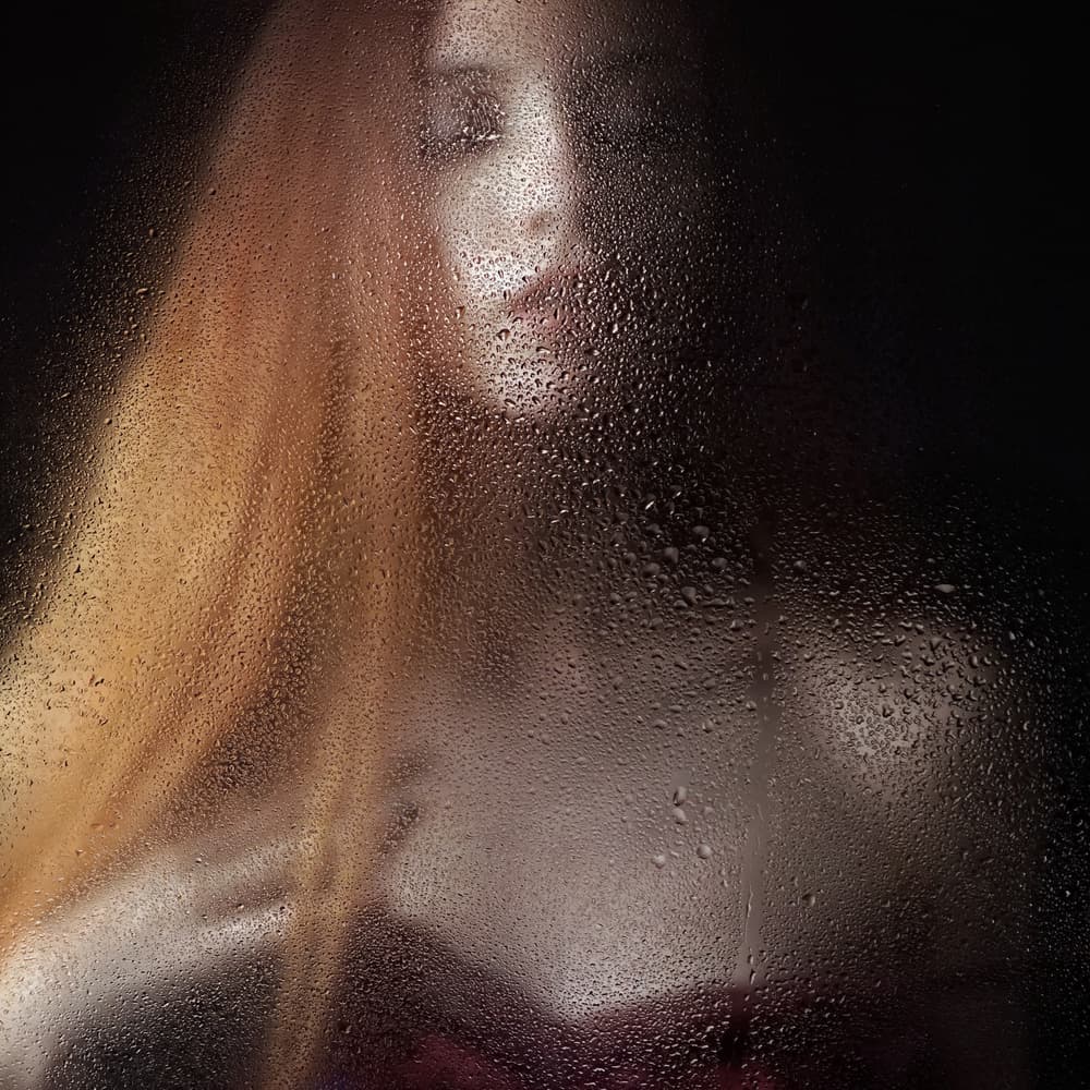 Woman Through Wet Glass by Bobby Kostadinov — canvas wall art