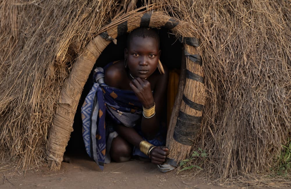 African Hut Portrait by Hamza Qarooni — canvas wall art