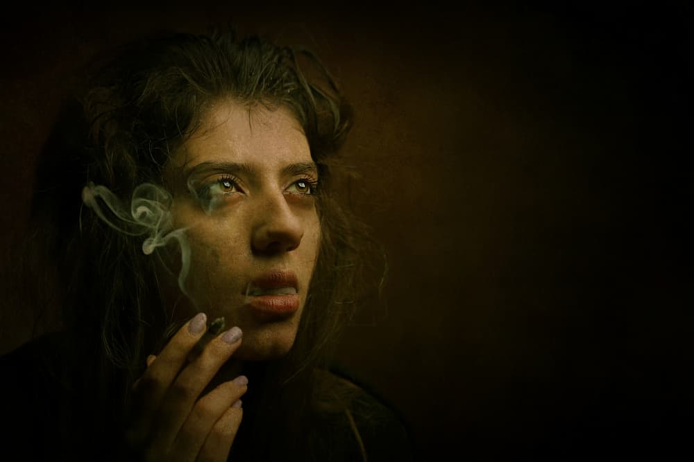 Pensive Woman with Smoke by Moein Hasheminasab — canvas wall art
