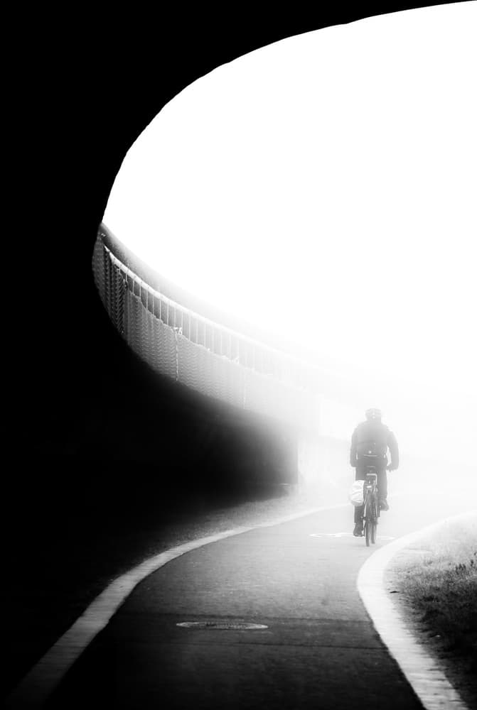 Cyclist Emerging Light by Anna Niemiec — canvas wall art