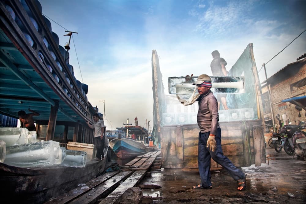 Men Loading Ice by Hari Sulistiawan — canvas wall art