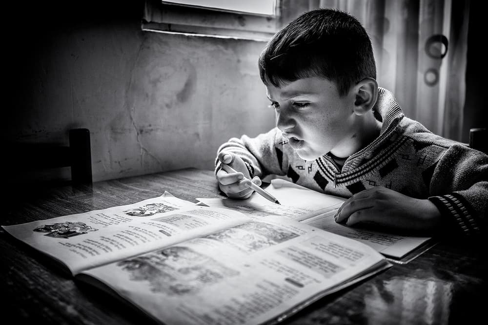 Boy Studying Homework by Marcel Rebro — canvas wall art