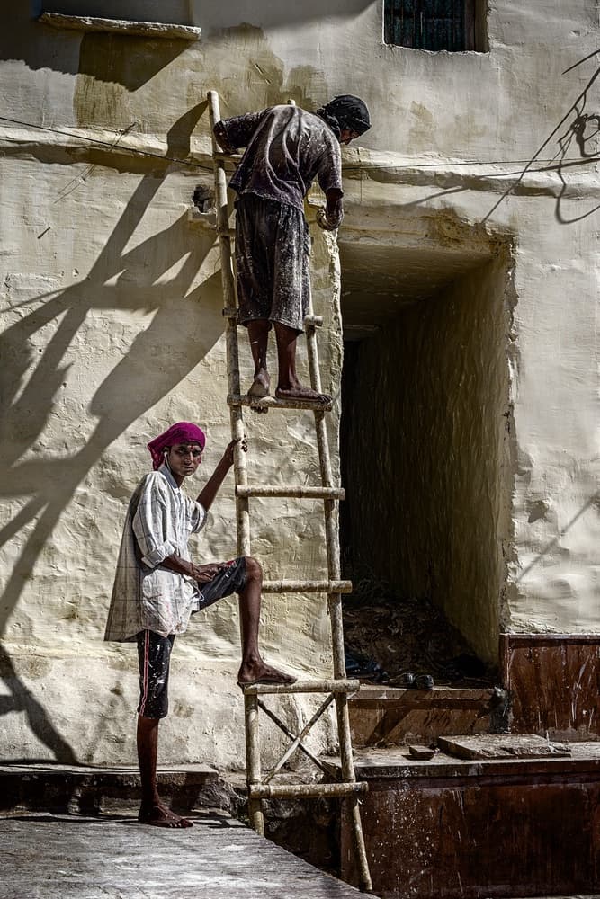 Indian Men on Ladder by Pavol Stranak — canvas wall art