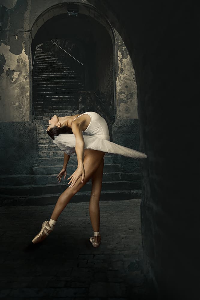 Ballerina in Dark Archway by Ionel Onofras — canvas wall art