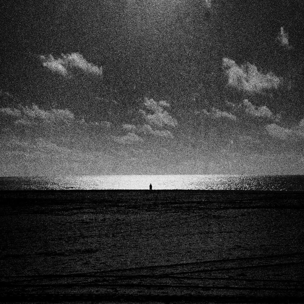 Solitary Figure Ocean Light by Paulo Abrantes — canvas wall art