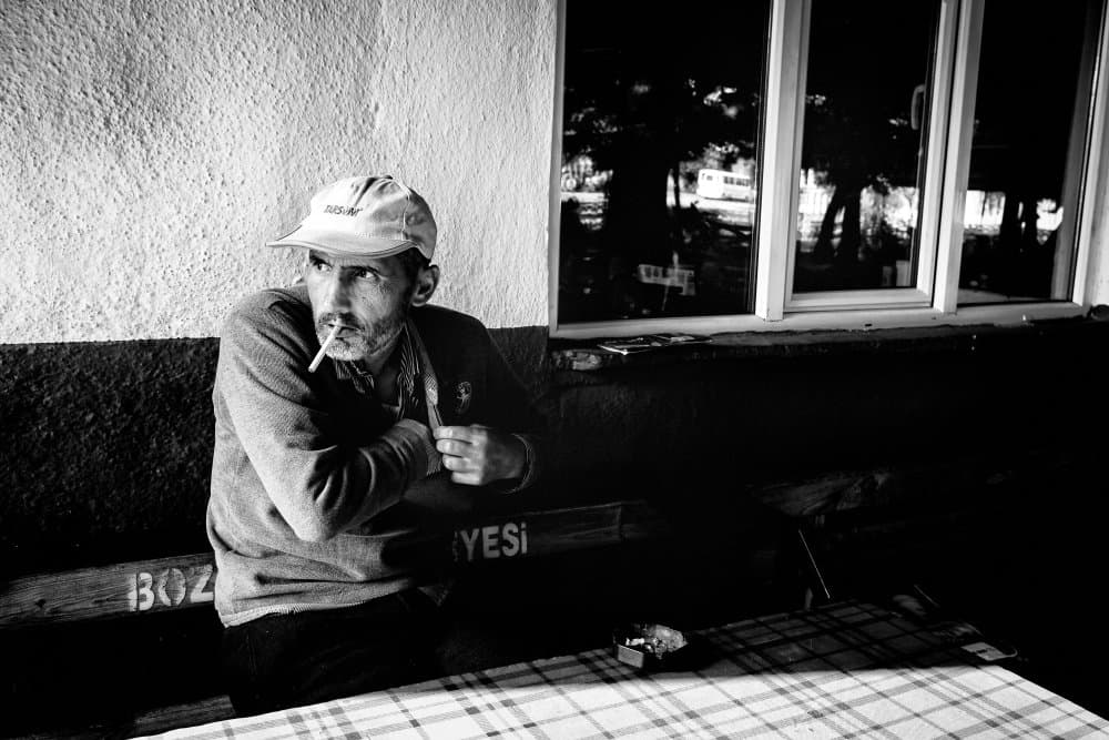 Pensive Man Smoking by M. Emre Erol — canvas wall art