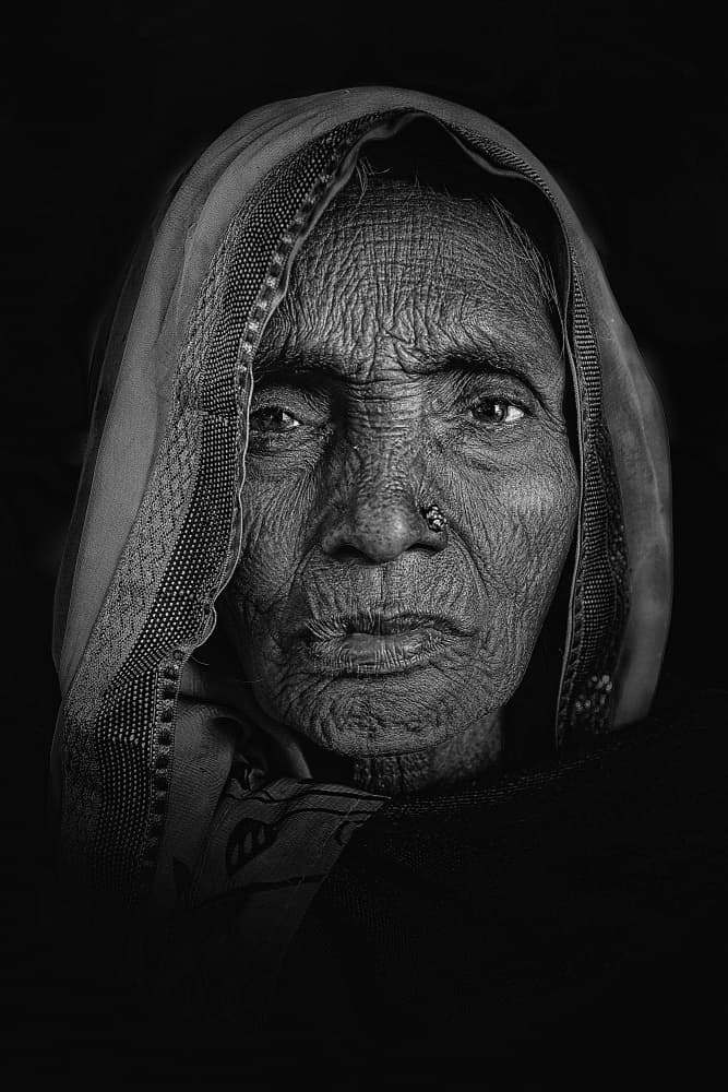 Aged Woman's Gaze by Shaibal Nandi — canvas wall art