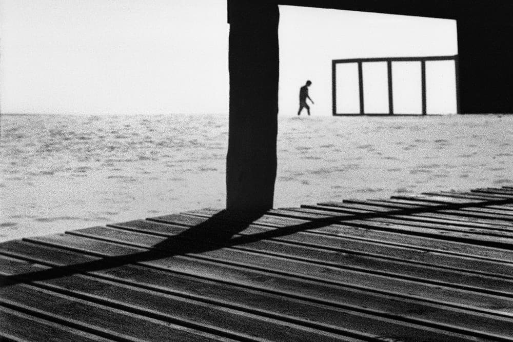 Man Walking Ocean Pier by Paulo Abrantes — canvas wall art
