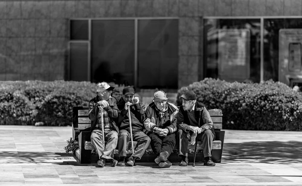Senior Friends Chatting by Ömer Ates Kızıltug — canvas wall art