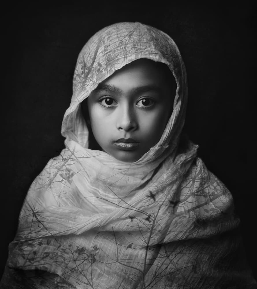 Young Girl's Gentle Gaze by Hari Sulistiawan — canvas wall art