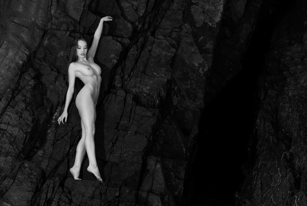 Elegant Nude Rock Pose by Joan Gil Raga — canvas wall art