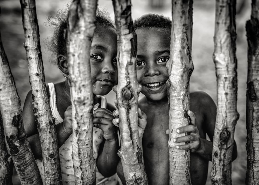 Joyful Children Peeking by Marco Tagliarino — canvas wall art