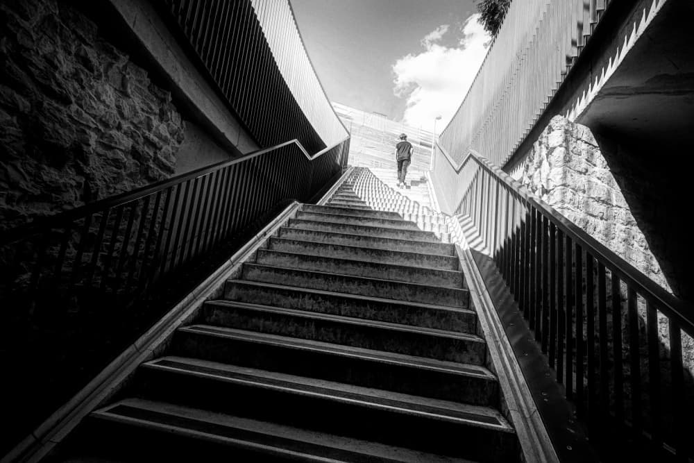 Lone Man on Grand Stairs by Bruno Flour — canvas wall art
