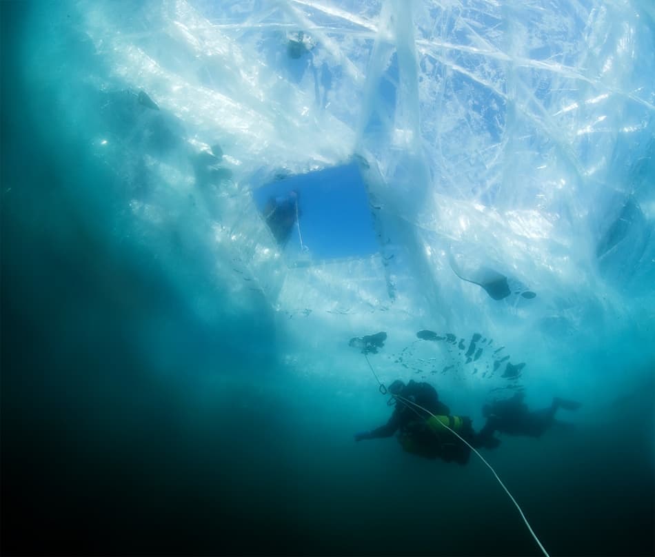Divers Beneath the Ice by Andrey Narchuk — canvas wall art