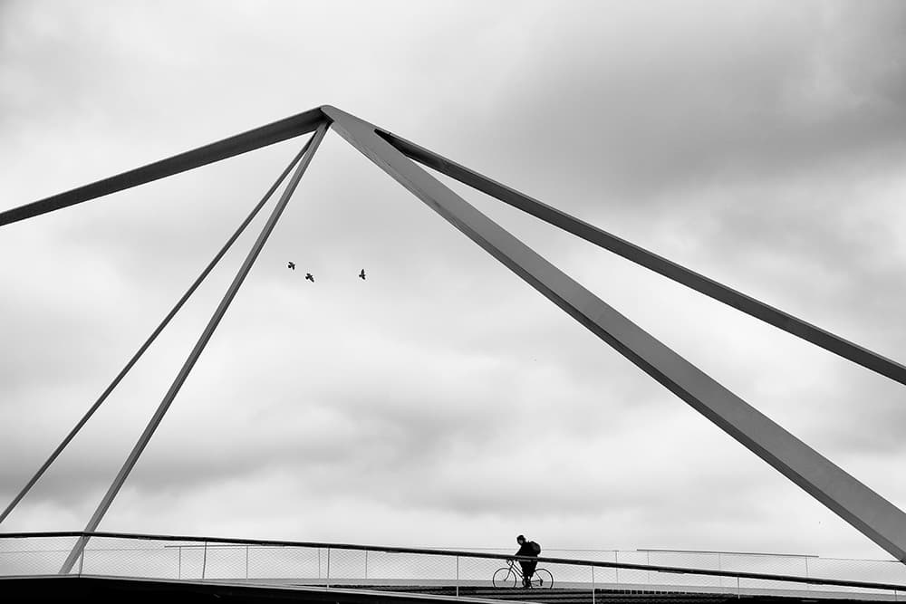 Modern Bridge Cyclist by Massimo Della Latta — canvas wall art
