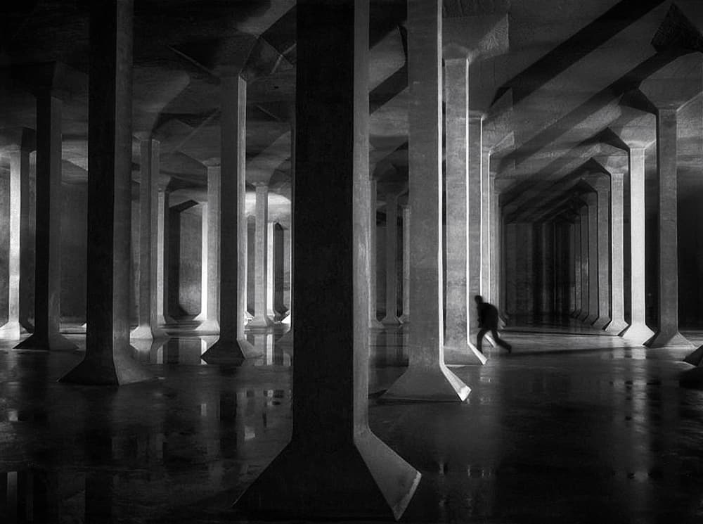 Lone Figure Concrete Columns by Holger Droste — canvas wall art