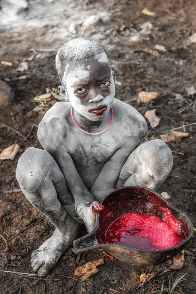Tribal Boy Ritual Drink by Trevor Cole — canvas wall art