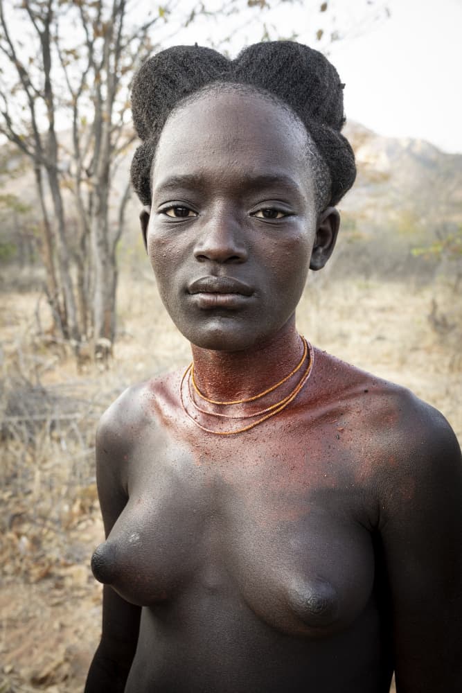 the pride and serenity of the Nguendelengo woman, southern Angola by Elena Molina — canvas wall art