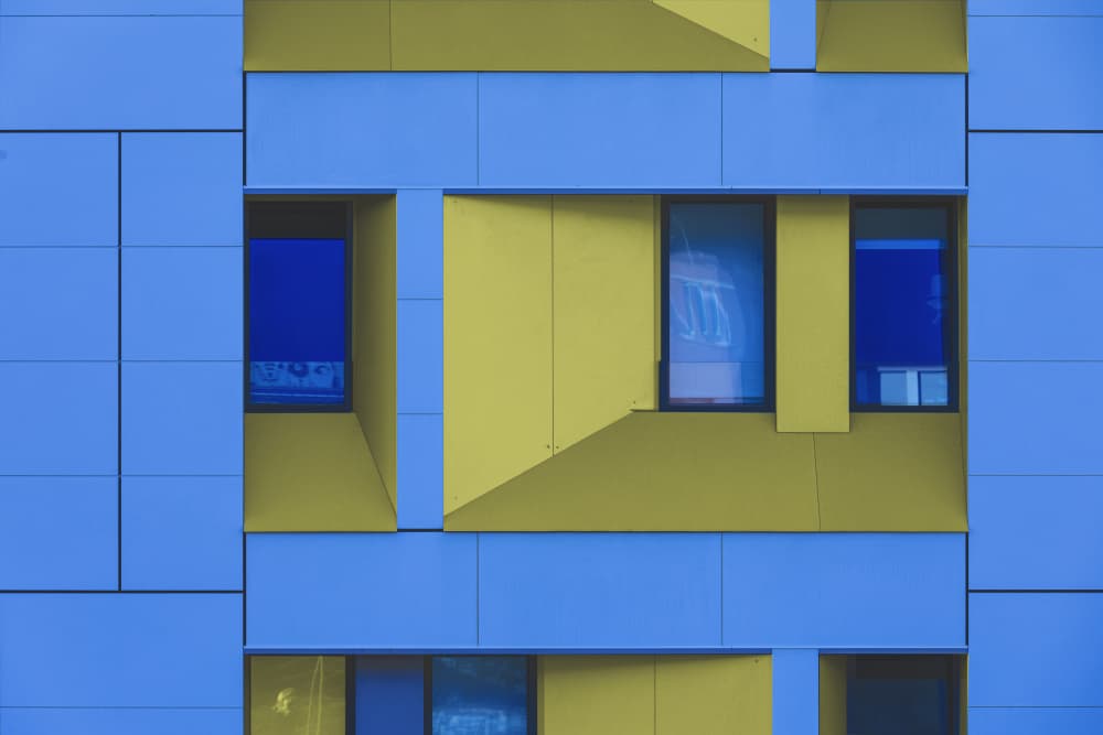 Geometric Blue Yellow Facade by Jois Domont ( J.L.G.) — canvas wall art