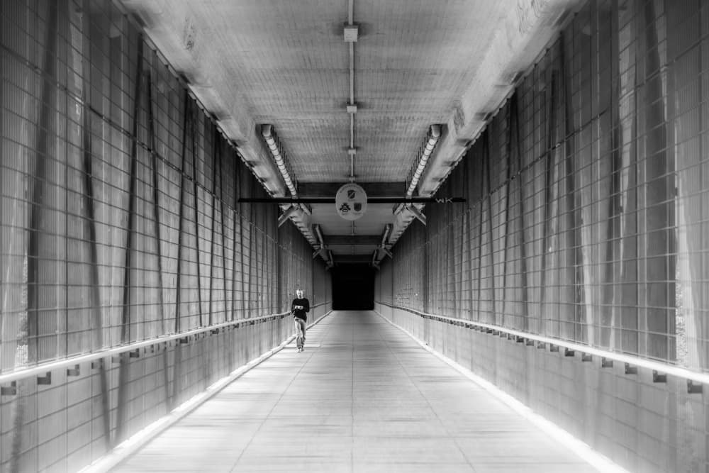 Cyclist In Long Tunnel by Andy Dauer — canvas wall art