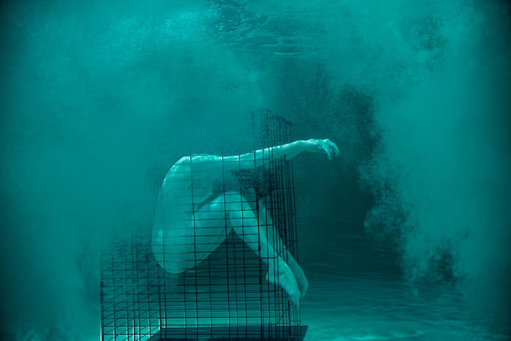 Caged Woman Underwater by Zanna — canvas wall art