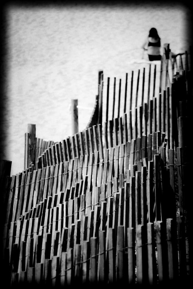 Coastal Fence Solitary Woman by Milena Seita — canvas wall art