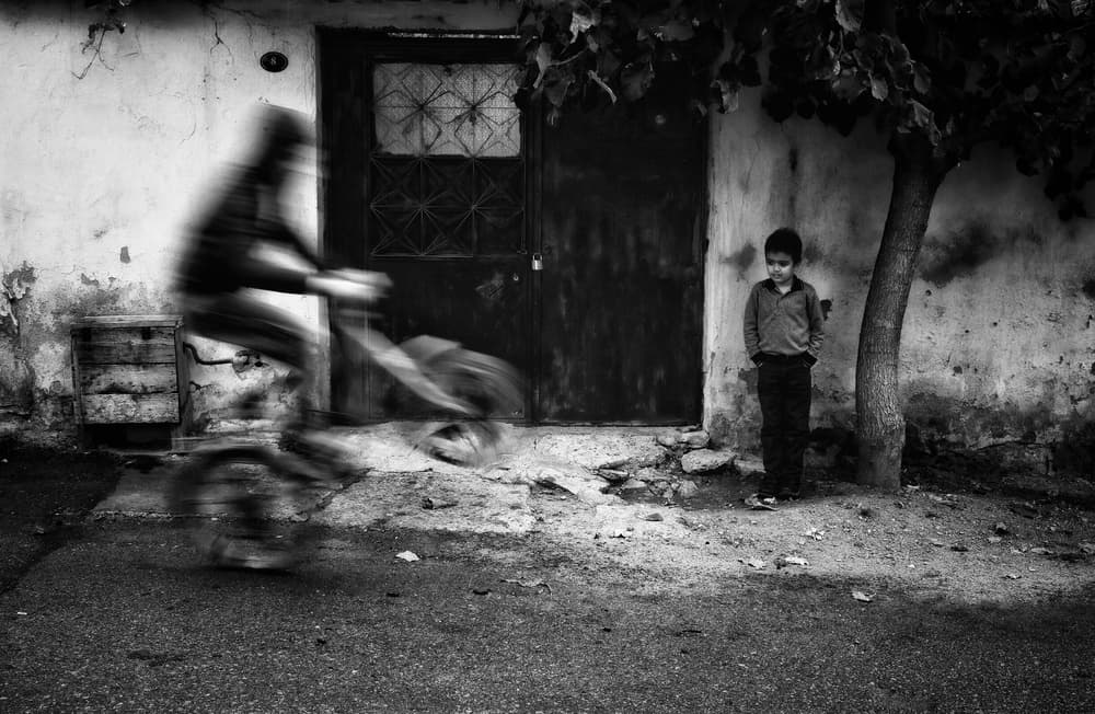 Still Boy Moving Bicycle by Ali Ayer — canvas wall art