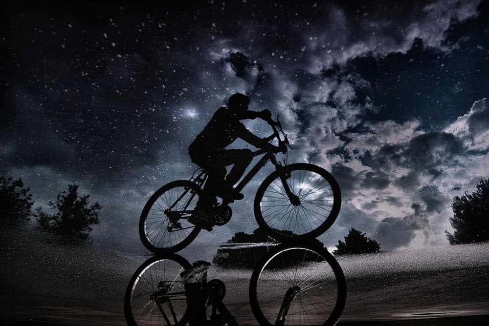 Night Cycling Reflection by Antonio Grambone — canvas wall art