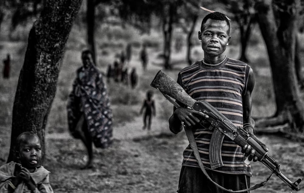 Armed African Village Life by Joxe Inazio Kuesta Garmendia — canvas wall art