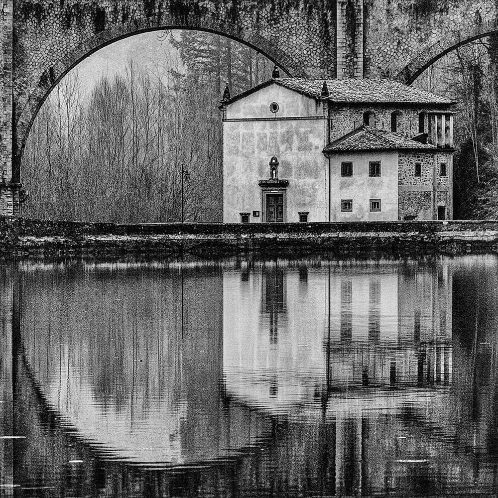 Historic Arch Bridge Reflection by Massimo Della Latta — canvas wall art