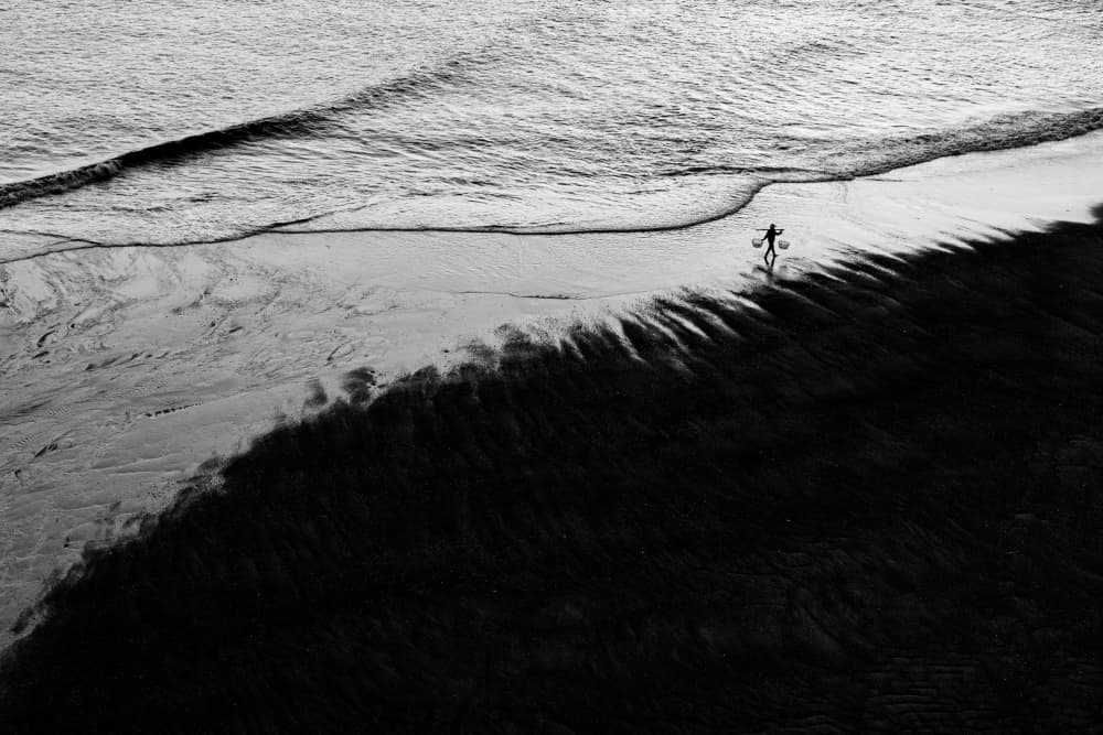 Lone Surfer Shadow by Gina Buliga — canvas wall art