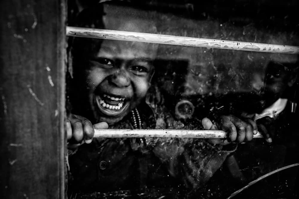 Smiling Child Through Window by Vedran Vidak — canvas wall art