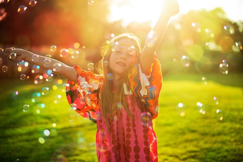 Joyful Girl Golden Bubbles by Elena Karagyozova — canvas wall art