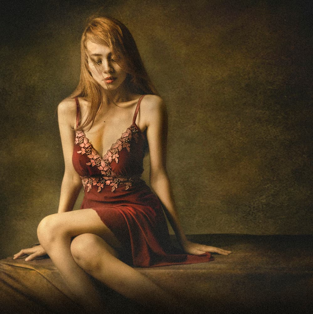 Pensive Woman In Red by Sebastian Kisworo — canvas wall art
