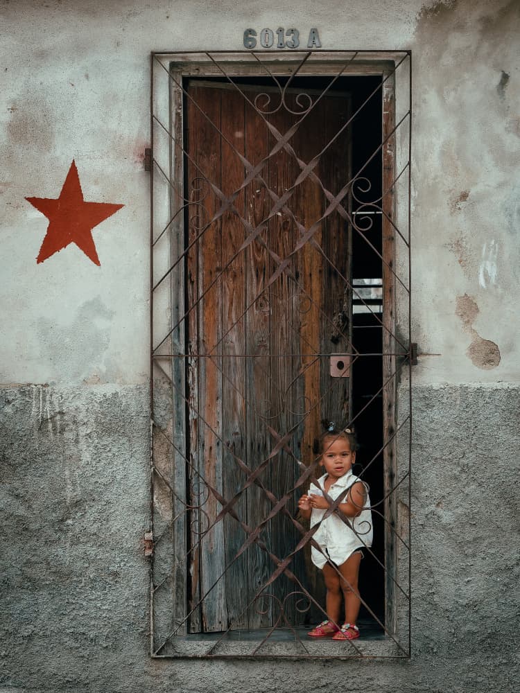 Curious Girl Doorway by Andy Bauer — canvas wall art