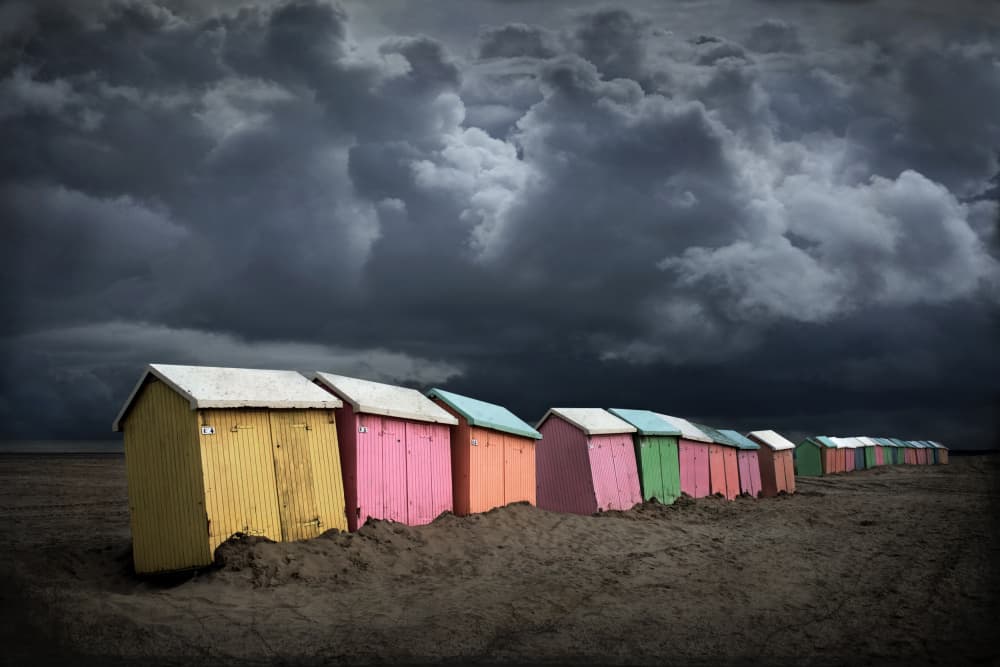 Colorful Huts Stormy Sky by Jan Scheunders — canvas wall art