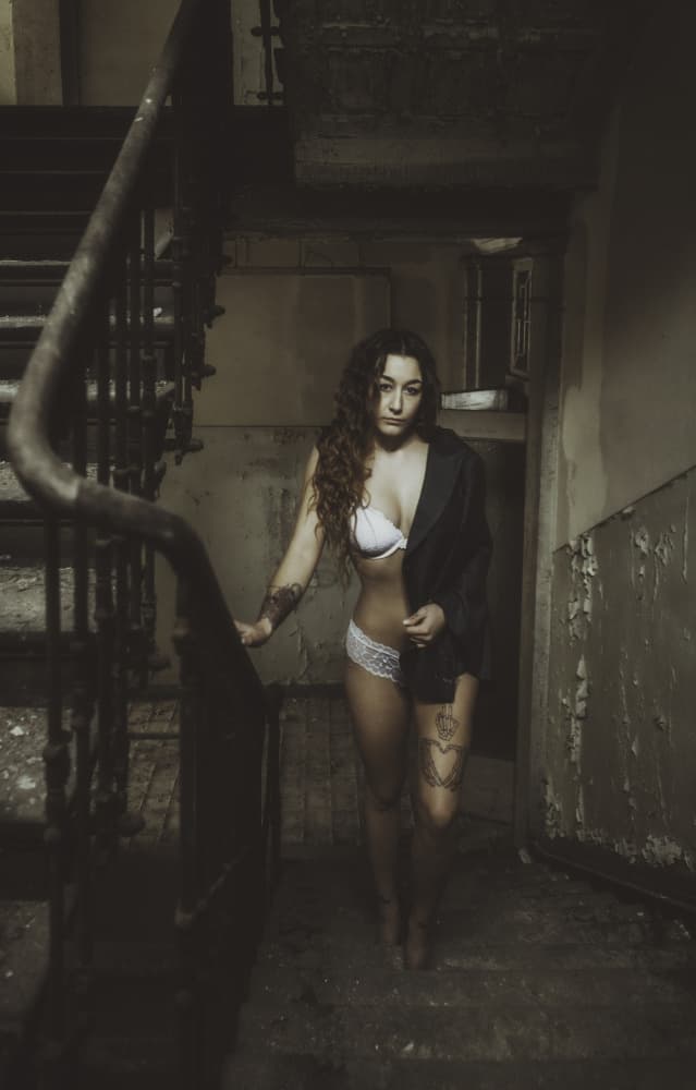 Woman on Dark Stairs by Georgios Bero — canvas wall art