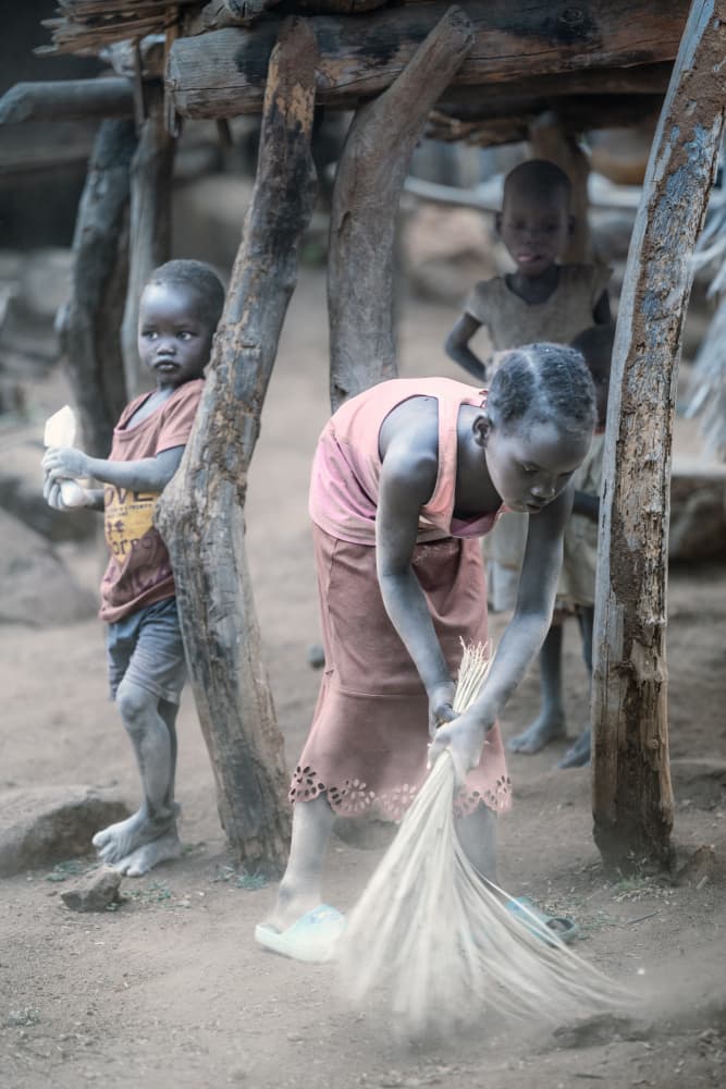 African Village Sweeping by Trevor Cole — canvas wall art