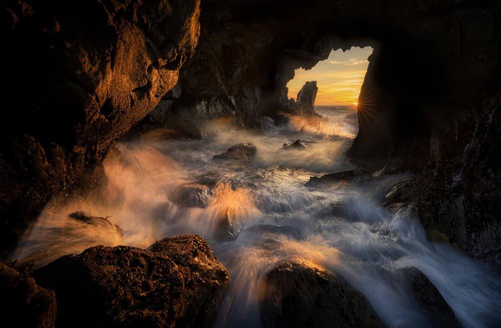 Golden Sea Cave Sunset by Lydia Jacobs — canvas wall art