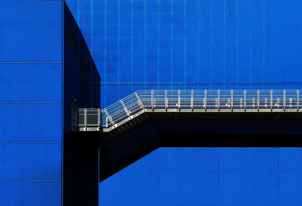 Blue Building Walkway by Arnon Orbach — canvas wall art