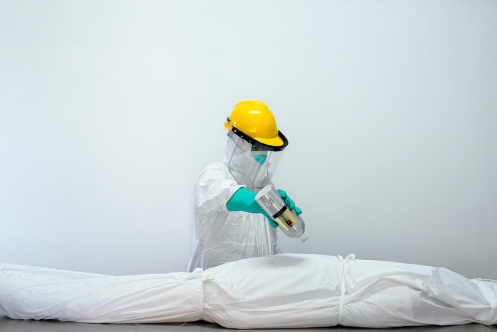 Protective Worker Decontaminating by Haitham AL Farsi — canvas wall art