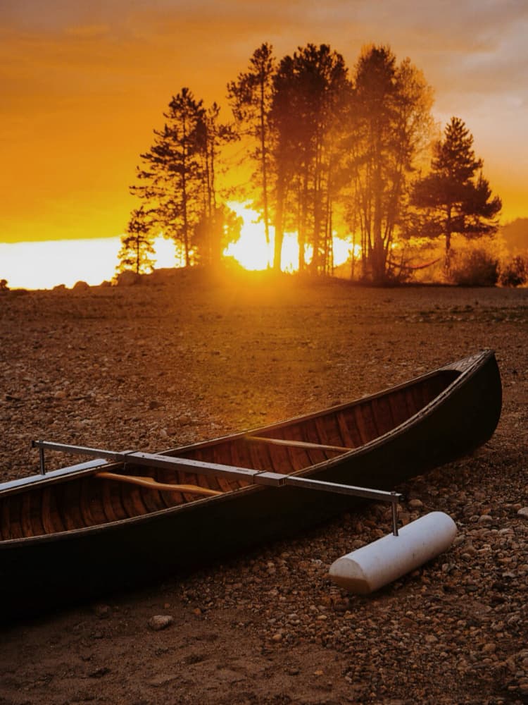 Golden Sunset Canoe by Del Mundo Imagery — canvas wall art