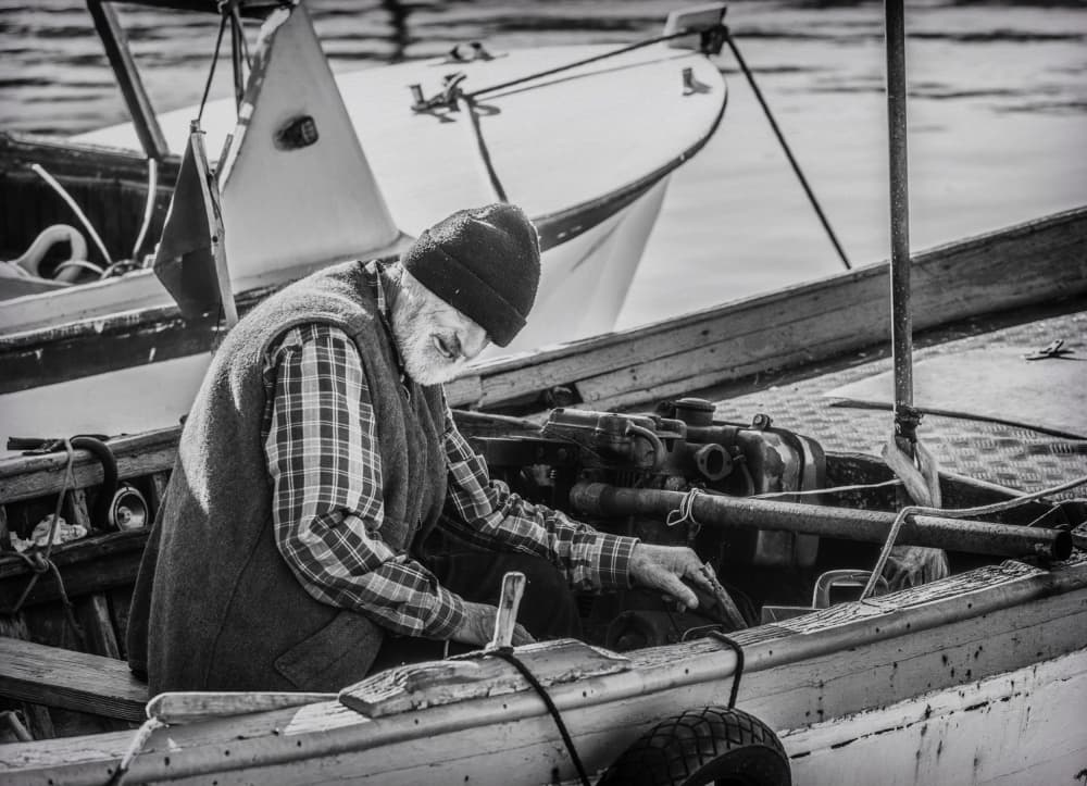 Old Man Boat Repair by Ömer Ates Kızıltug — canvas wall art