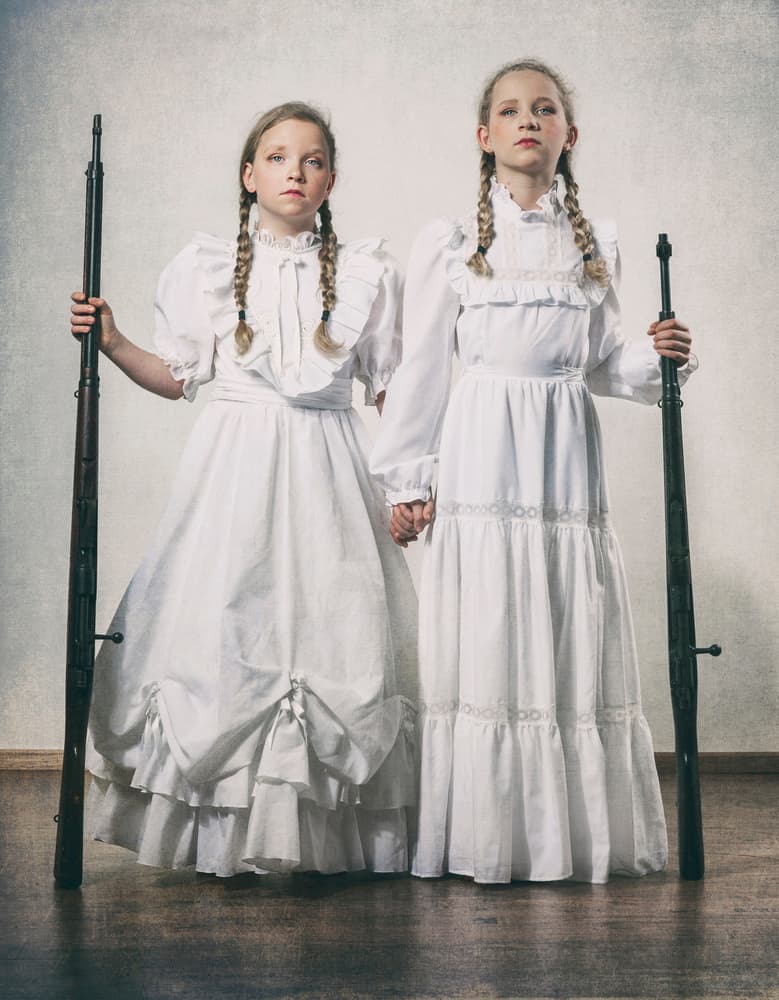 Sisters Holding Rifles by Monika Vanhercke — canvas wall art
