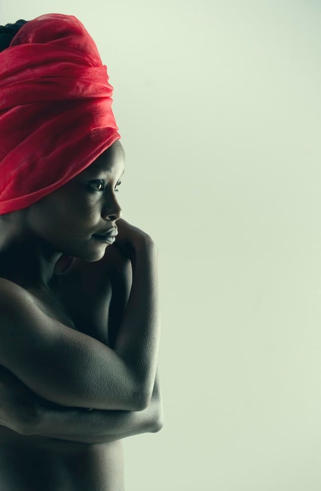 Woman in Red Headwrap by Mel Brackstone — canvas wall art