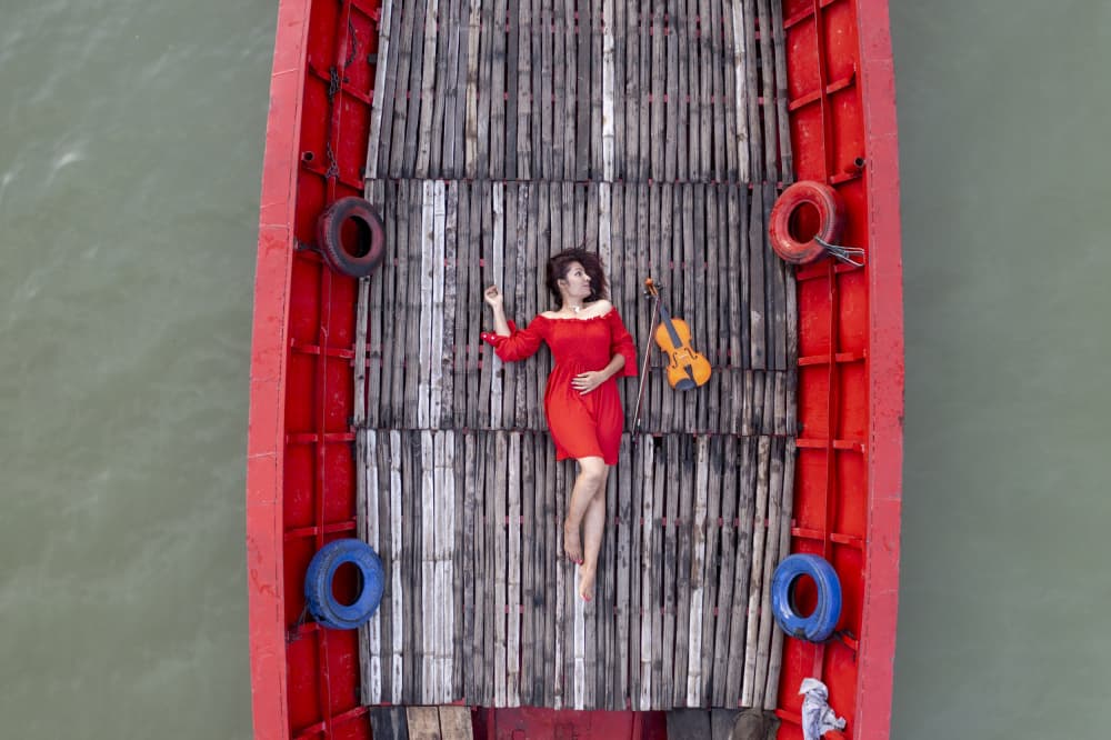 Woman in Red Boat by Azim Khan Ronnie — canvas wall art