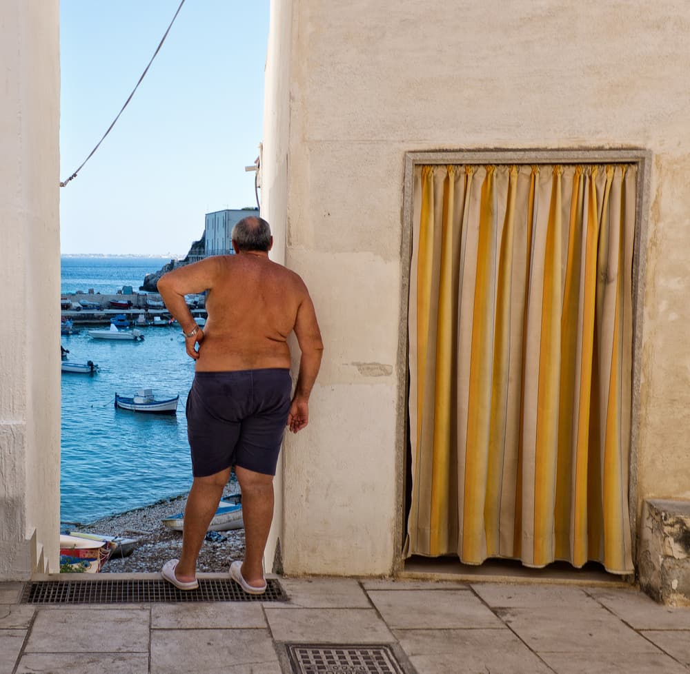 Man Overlooking Blue Harbor by Lorenzo Grifantini — canvas wall art