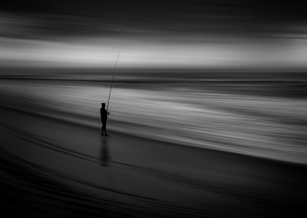 Moody Beach Angler by Hein Jonker — canvas wall art