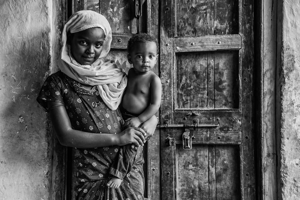 Tender Siblings Portrait by Mohammed Alnaser — canvas wall art