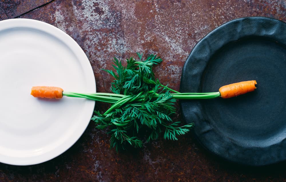 Balanced Carrots On Plates by Karina Aleksandrova — canvas wall art